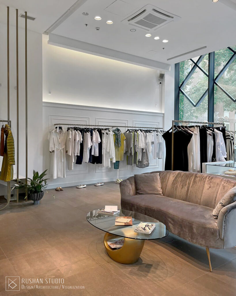 KNT clothing store interior with soft tones, decorative mirrors and modern classic character