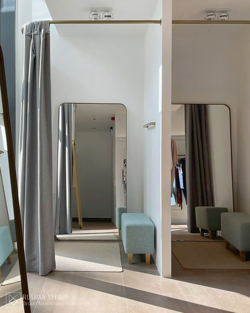 KNT boutique interior view with sophisticated lighting, soft furniture and polished retail design