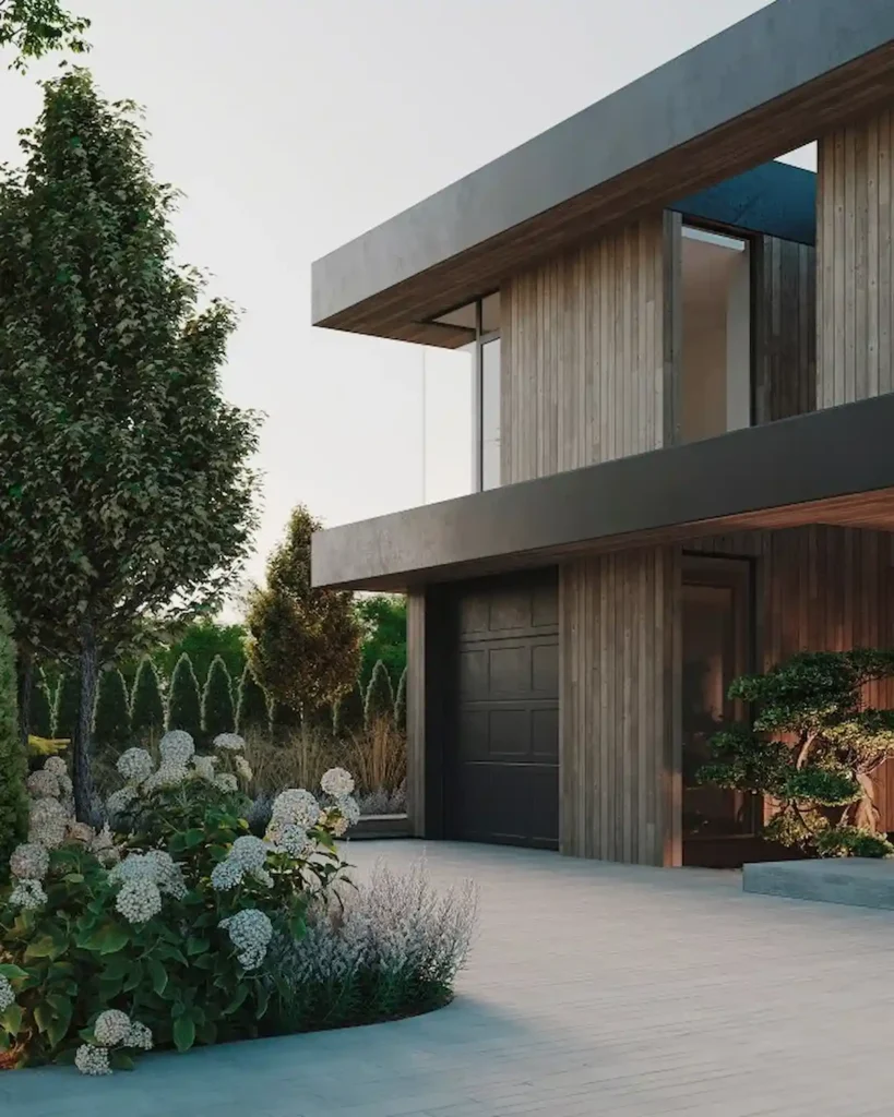 Private house entrance with layered planting, hydrangeas, hedges and modern exterior materials