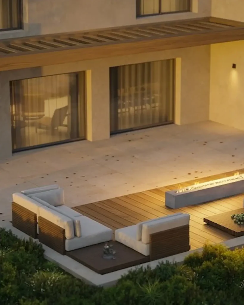 Outdoor lounge terrace with fire feature, integrated lighting and planting for a villa landscape project